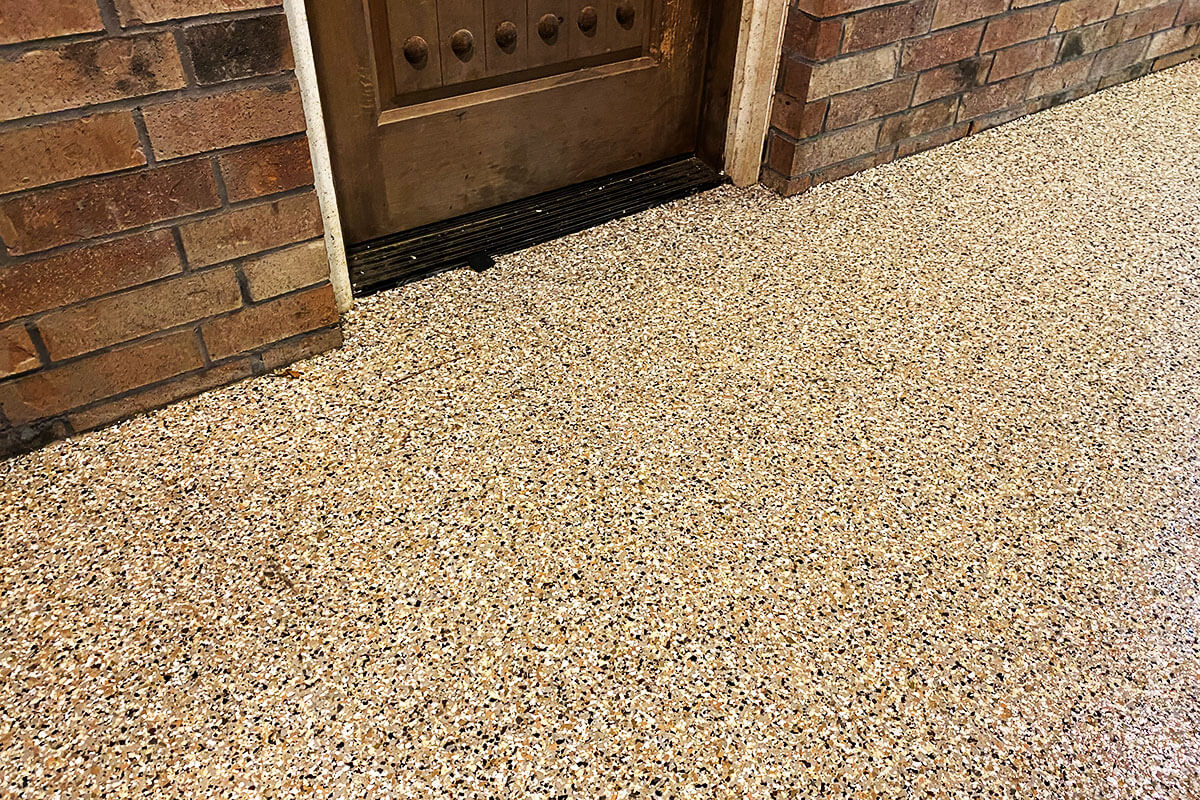 Coated concrete at entryway