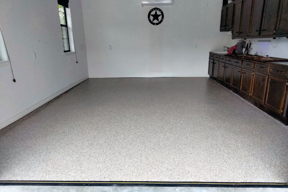 Garage with coated floor and cove base